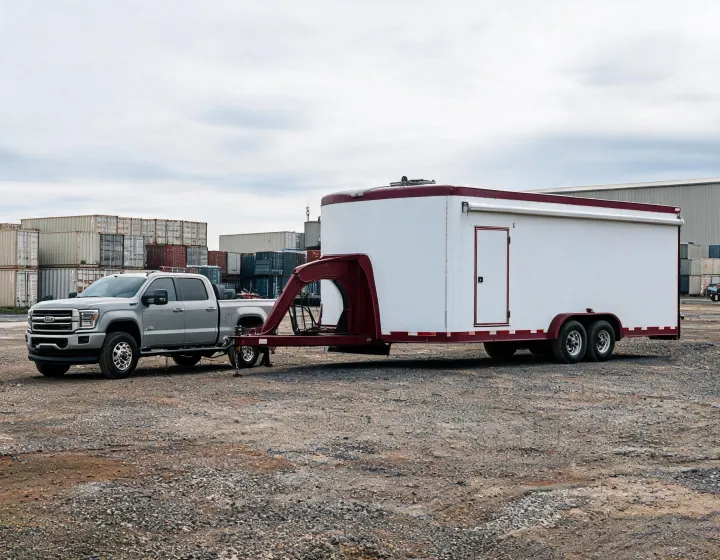 Custom cargo gooseneck trailer at a commercial loading yard