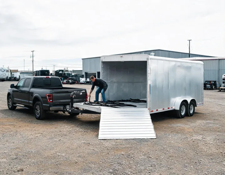 Aluminum gooseneck cargo trailer serving commercial equipment transport
